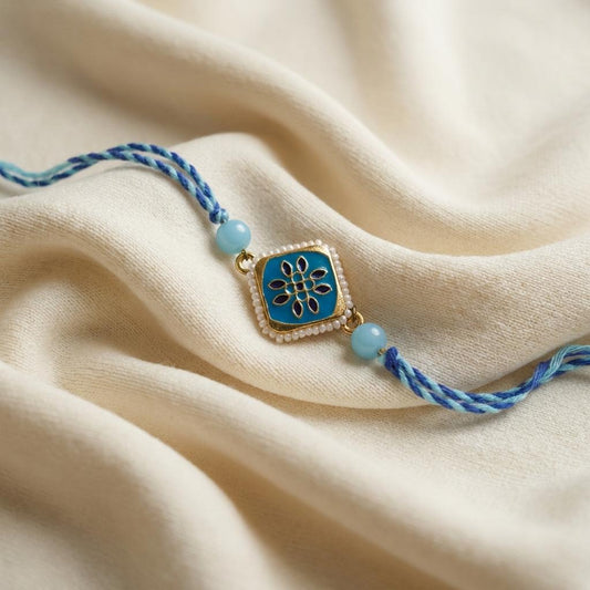Elegant Blue Enamel Floral Rakhi with Pearl Border & Thread