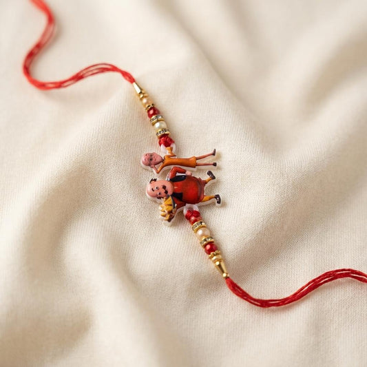 Playful Motu Patlu Rakhi for Kids with Red Braided Thread