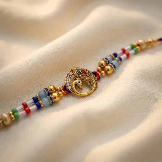 Majestic Peacock Feather Gold Rakhi with Multicolor Beads & Thread
