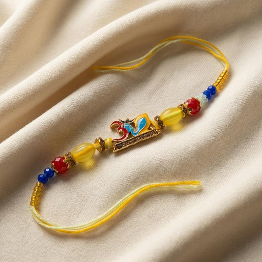 Colorful Enamel Om Rakhi with Gold Beads & Crystal Embellishment - selfie to print