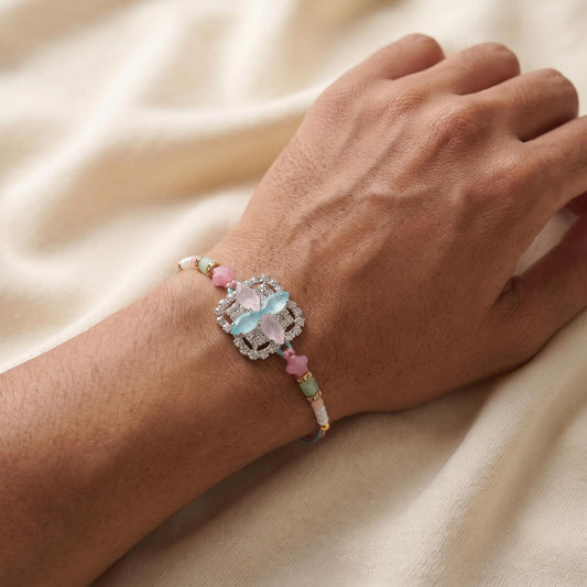 Elegant Pastel Crystal Butterfly Rakhi with Colorful Beads