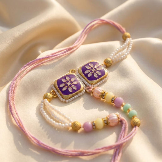 Purple Floral Twin Motif Pearl Rakhi with Pastel Bead Tassels