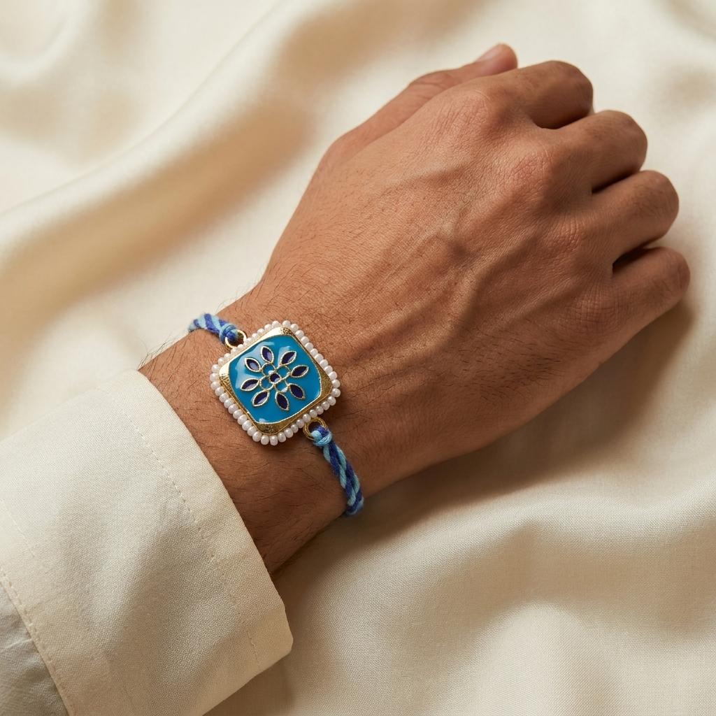 Elegant Blue Enamel Floral Rakhi with Pearl Border & Thread