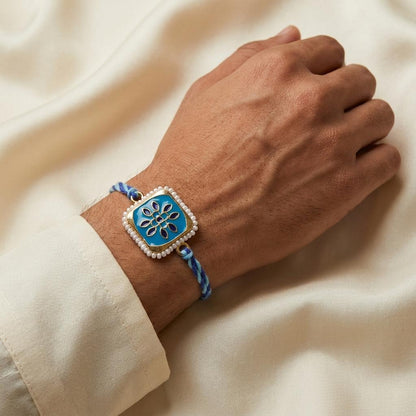 Elegant Blue Enamel Floral Rakhi with Pearl Border & Thread