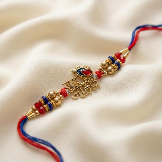 Ethnic 'Jai Johar' Gold-Tone Rakhi with Red & Blue