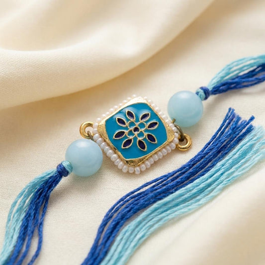 Elegant Blue Enamel Floral Rakhi with Pearl Border & Thread