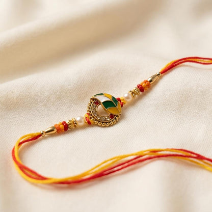 Sacred Yellow Red Thread Rakhi with Green Enamel & Pearl