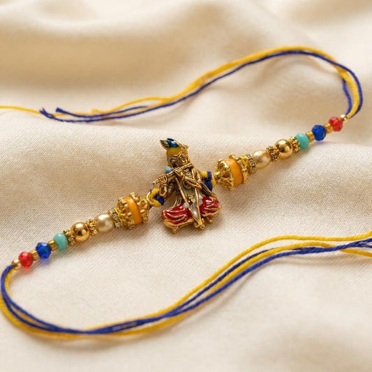 Divine Lord Krishna Flute Rakhi with Gold & Multicolor Beads