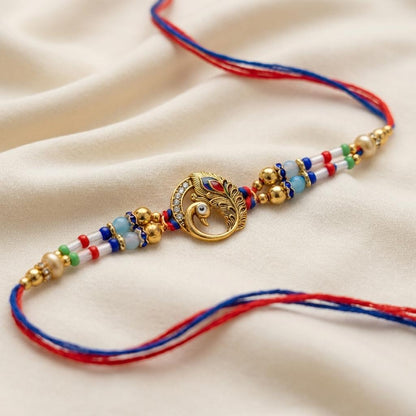 Majestic Peacock Feather Gold Rakhi with Multicolor Beads & Thread