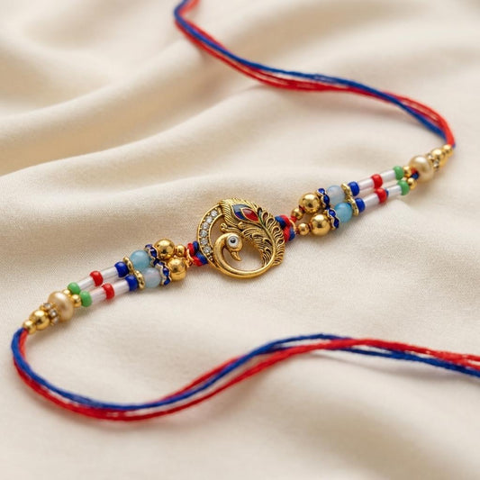 Majestic Peacock Feather Gold Rakhi with Multicolor Beads & Thread