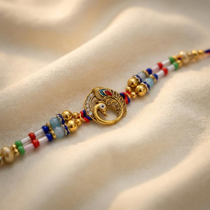 Majestic Peacock Feather Gold Rakhi with Multicolor Beads & Thread