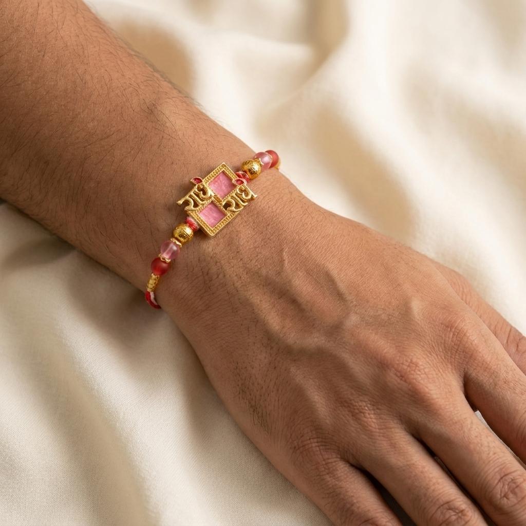Divine Radhe Krishna Gold Rakhi with Pink Enamel & Red Beads