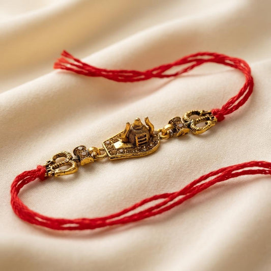 Sacred Shivling Antique Gold Rakhi with Red Twisted Thread