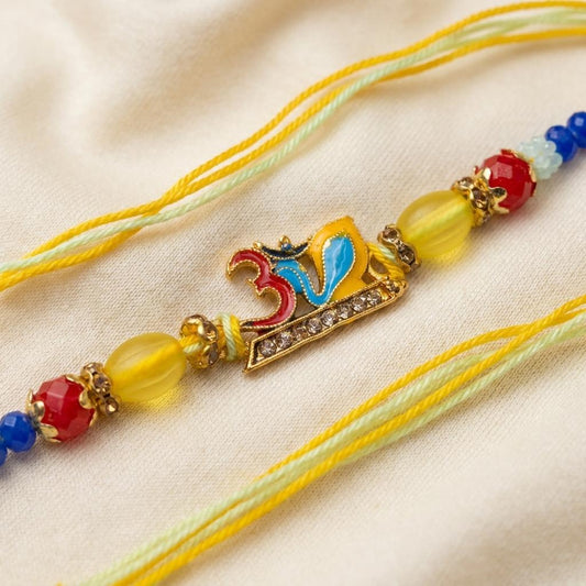 Colorful Enamel Om Rakhi with Gold Beads & Crystal Embellishment - selfie to print