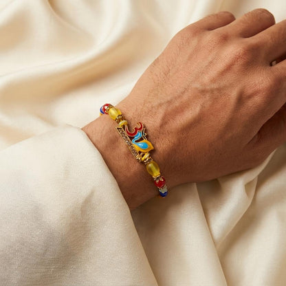 Colorful Enamel Om Rakhi with Gold Beads & Crystal Embellishment - selfie to print