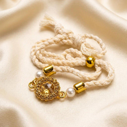 Elegant Crystal Halo Rakhi with Pearls & Braided Cord - selfie to print
