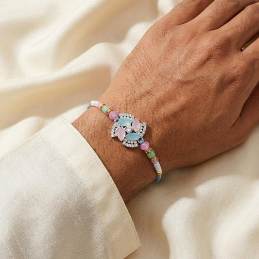 Elegant Pastel Gemstone Rakhi with Silver-Tone Rhinestones - selfie to print