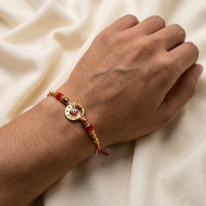 Handcrafted Evil Eye Rakhi with Red & Gold Beaded Thread - selfie to print