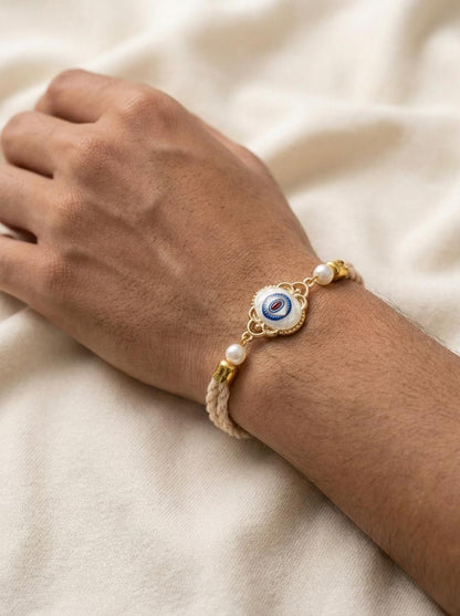 Handmade Evil Eye Stone Rakhi with Pearl & Gold Filigree - selfie to print