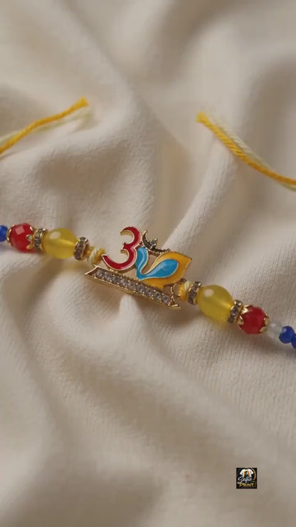 Colorful Enamel Om Rakhi with Gold Beads & Crystal Embellishment