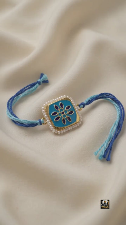 Elegant Blue Enamel Floral Rakhi with Pearl Border & Thread