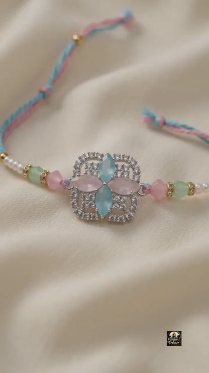 Elegant Pastel Gemstone Rakhi with Silver-Tone Rhinestones
