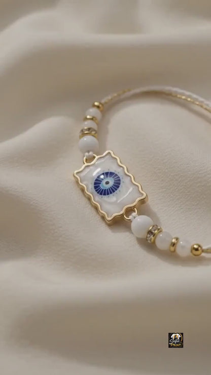 Elegant Gold Scalloped Evil Eye Stone Rakhi with Crystal Beads