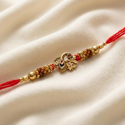 Traditional Gold Om Peacock Feather Red Thread Rakhi for Brother - selfie to print