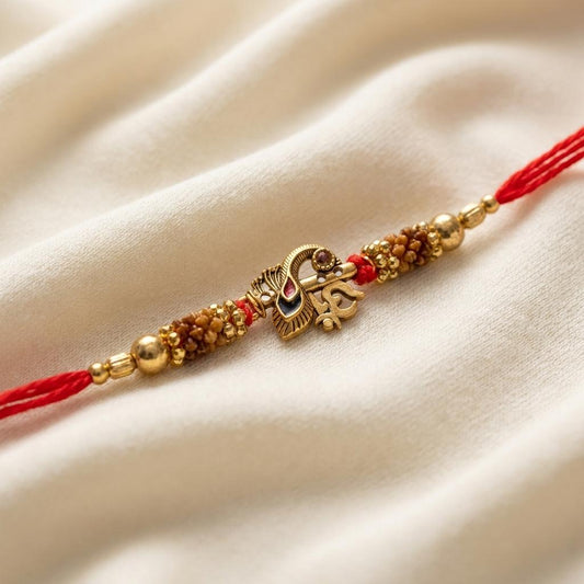 Traditional Gold Om Peacock Feather Red Thread Rakhi for Brother - selfie to print